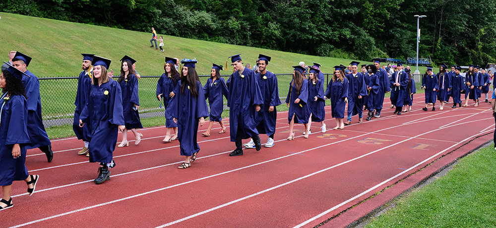 The Class of 2022 walk out onto the football field for the 2022 Commencement Ceremony.